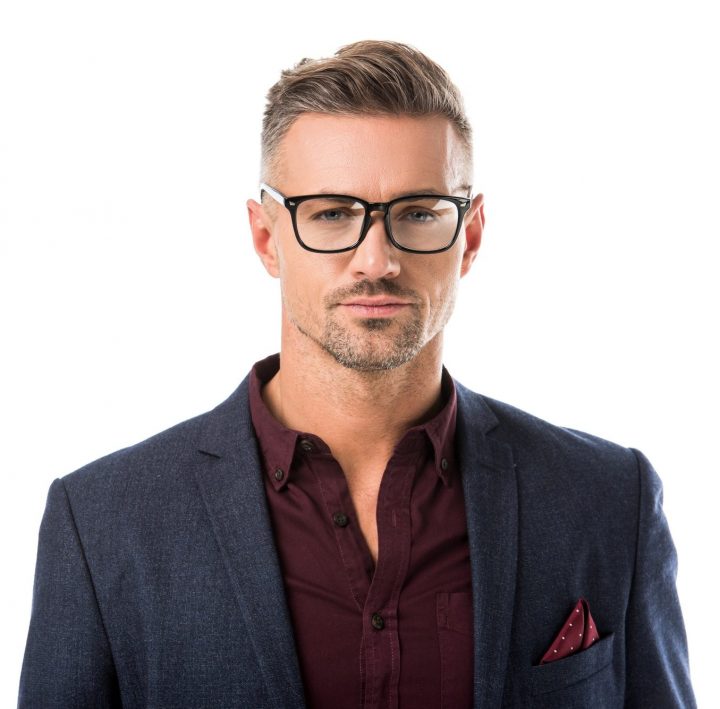 portrait-of-stylish-man-in-eyeglasses-and-jacket-looking-at-camera-isolated-on-white-e1628013869204.jpg